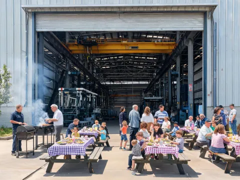 Plant open day BBQ beside crawler and overhead crane fleet